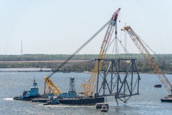 crane barge Chesapeake 1000 moves a large piece of supporting steel from Key Bridge in Baltimore