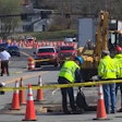 workers rescuers at site where police officer struck killed by excavator