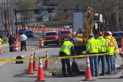 workers rescuers at site where police officer struck killed by excavator