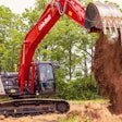 Link-Belt 220 X4S excavator dumping dirt