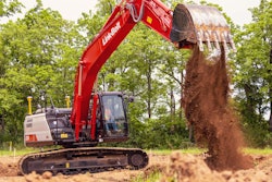 Link-Belt 220 X4S excavator dumping dirt