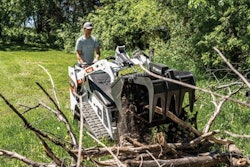 Bobcat MT100 mini track loader with a grapple attachment