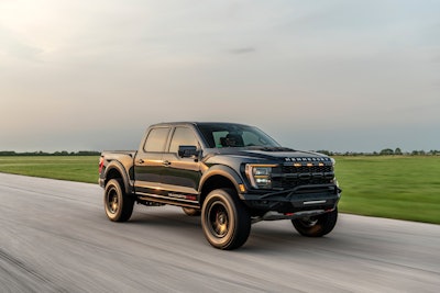 black Hennessey 2024 Ford F-150 Velociraptor side view on road