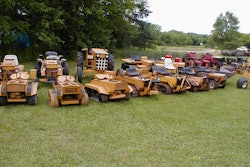 collection of struck mini dozers tractors on lawn