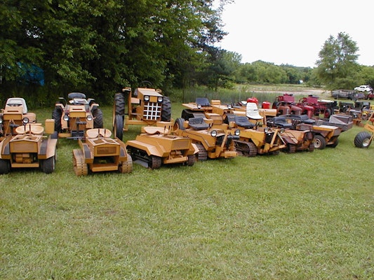 collection of struck mini dozers tractors on lawn