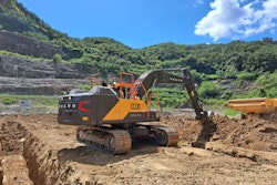 new Volvo CE EC230 excavator digging trench