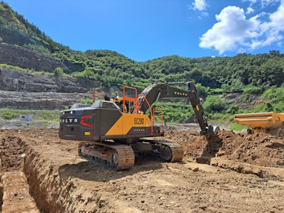 new Volvo CE EC230 excavator digging trench