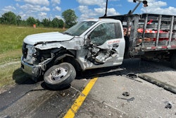 Road Worker truck after semi trailer crashed into it