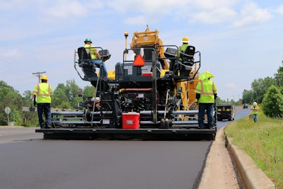 paver laying asphalt road