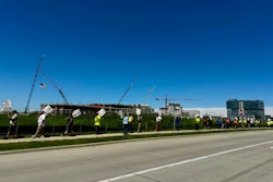 local 139 iuoe union picket sidewalk in front of crane construction site