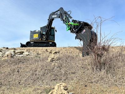 Werk-Brau branded Tiltrotator with bucket digging down hill