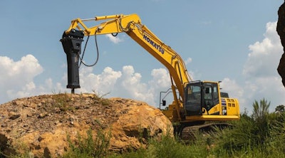 komatsu hydraulic breaker on komatsu excavator breaking rock