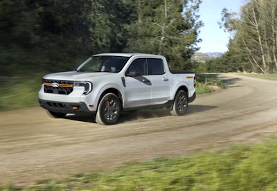 white 2025 Ford Maverick Tremor dirt road