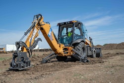 CASE 580EV Backhoe Loader with plate compactor in dirt