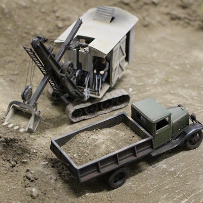 model of Thew shovel dumping dirt in dump truck