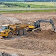 Excavator loading a haul truck