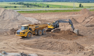 Excavator loading a haul truck