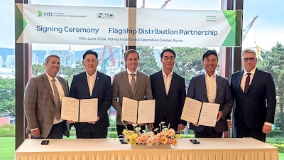 NED and hyundai CE executives sign distribution agreement under banner