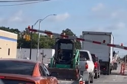 Trinity Express train hits trailer hauling a skid steer parked on the tracks in Fort Worth, Texas