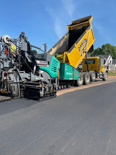 D'Amico dump truck feeding asphalt paver
