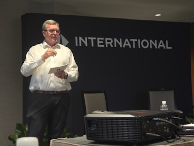 Dan Kayser, International, speaking on stage