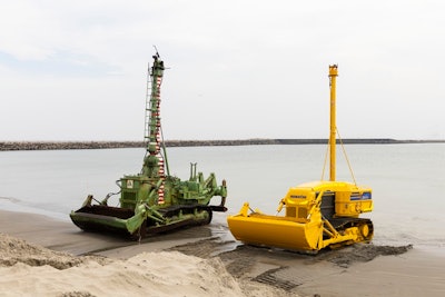 old Komatsu underwater dozer and concept underwater construction robot side by side