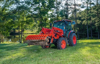 a kioti RX40 tractor moving a log around a property