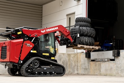 Yanmar TL75VS compact track loader carrying a pallet of tires