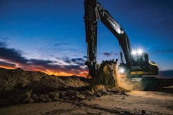 john Deere 350 P-Tier Excavator digging at dusk