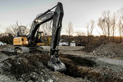 john Deere 350 P-Tier excavator digging trench