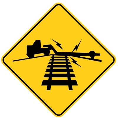 yellow warning sign low ground clearance railroad crossing