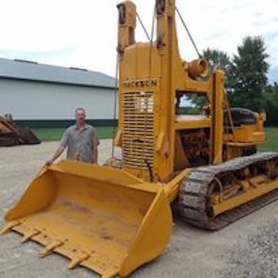 Bill Deutsch standing beside late 1940s Trackson T6 Traxcavator on Cat D6