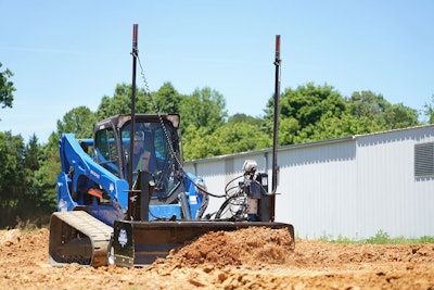 Blue diamond land grader attachment on compact track loader pushing dirt