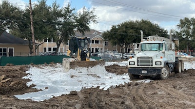 bulldozer and truck on EMi Construction jobsite
