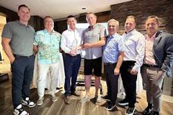 leaders of great west equipment accept their award