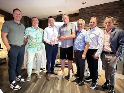 leaders of great west equipment accept their award