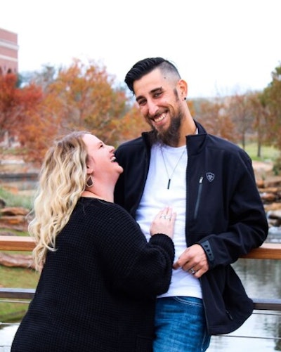 Justin Delgado poses with a woman