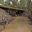DOT workers repair a bridge after hurricane helene