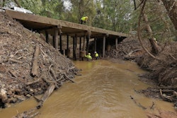 DOT workers repair a bridge after hurricane helene