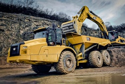 Cat 745 Articulated Dump Truck being loaded by a Cat Excavator