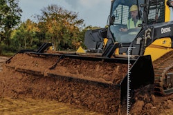 Deere compact track loader pushing dirt