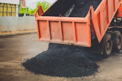 Dump Truck unloading asphalt