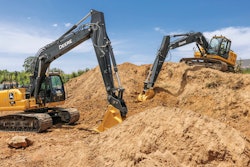 John Deere excavators digging dirt