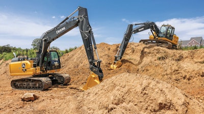 John Deere excavators digging dirt