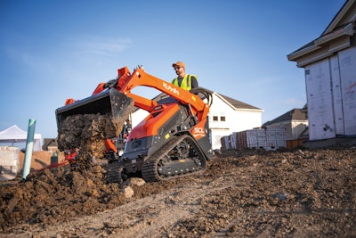Kubota SCL1000 mini track loader dumping dirt