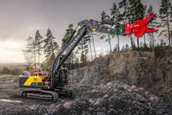 Volvo EC400 excavator boom arm extended with red crusher jaw attachment
