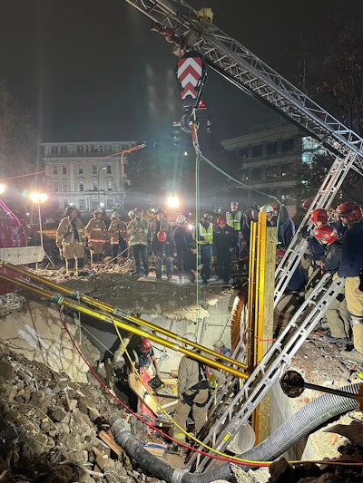 night at scene of worker trapped in hole at demolition site in louisville ky