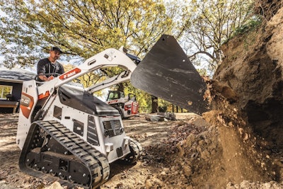 bobcat mt100 mini track loader with bucket dumping dirt