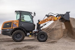a case electric compact wheel loader moves dirt