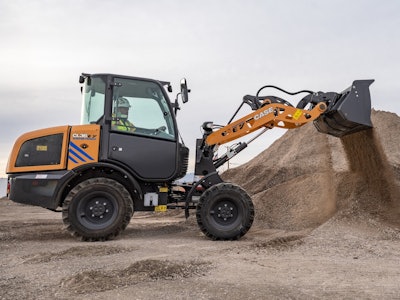 a case electric compact wheel loader moves dirt